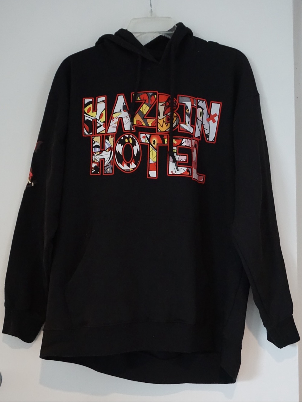 Hot Topic Black Hazbin Hotel Graphic Hoodie with Red & Yellow Accents